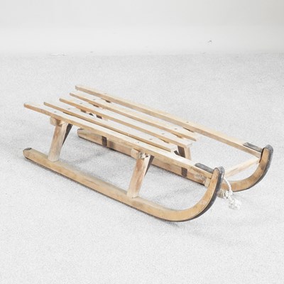 Lot 123 - A vintage wooden sledge, 90cm long