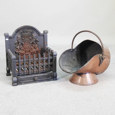 Lot 457 - A cast iron fire grate, together with a copper...