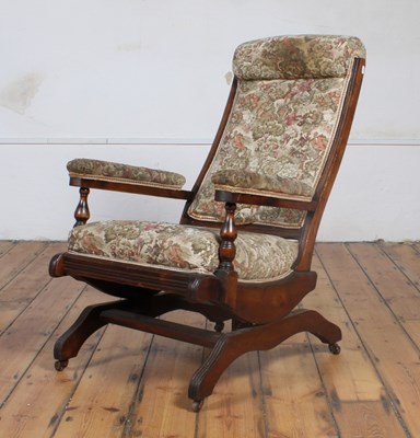 Lot 436 - A 19th century walnut American style rocking...