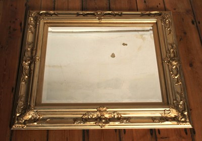 Lot 663 - A gilt framed wall mirror, having a bevelled...