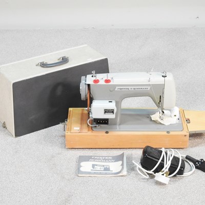 Lot 391 - A Frister and Rossman electric sewing machine,...