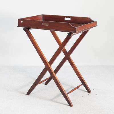 Lot 223 - A 19th century mahogany butler's tray, on a...