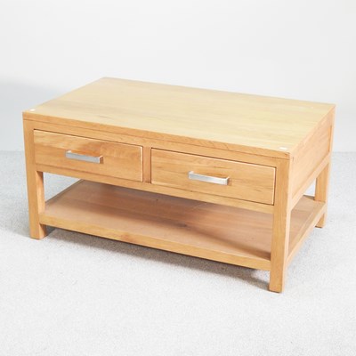 Lot 447 - A modern light oak coffee table, with two drawers