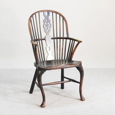 Lot 152 - An elm seated windsor armchair, 20th century,...