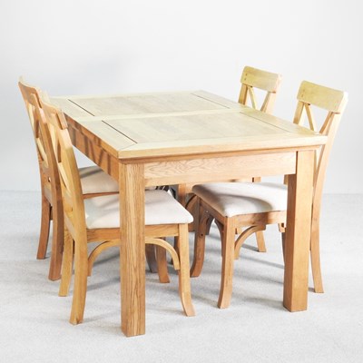 Lot 489 - A modern light oak dining table, together with...