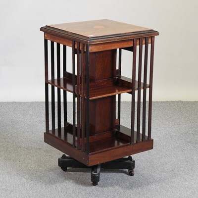 Lot 689 - An Edwardian mahogany and inlaid revolving bookcase