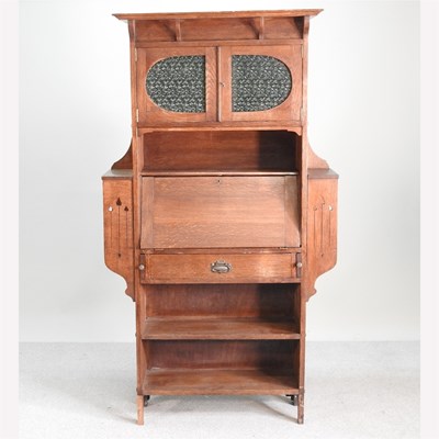 Lot 515 - An Arts and Crafts bureau bookcase, with a...