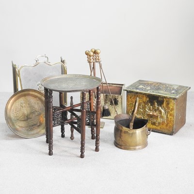 Lot 517 - A collection of brass fire tools, together...