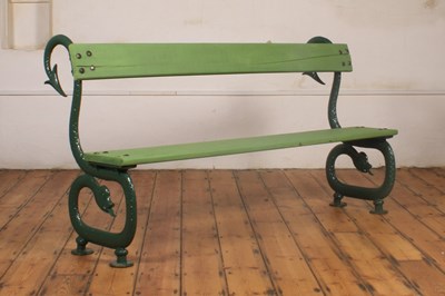 Lot 423 - A Victorian green painted cast iron bench, the...