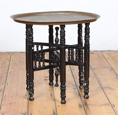 Lot 485 - A Benares brass table, the top engraved with...