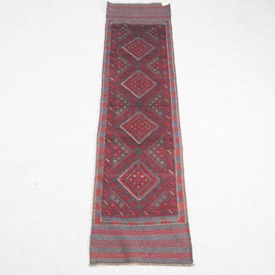 Lot 208 - A Persian runner, with a row of central...