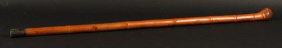 Lot 648 - A Japanese fishing rod concealed in a walking...