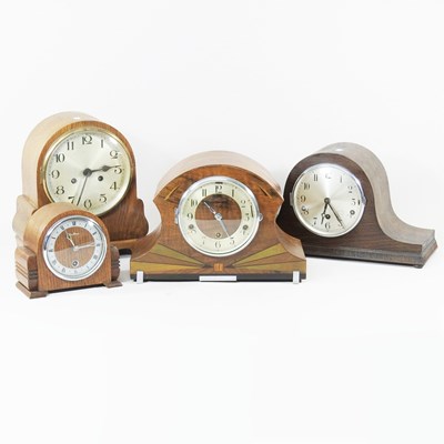 Lot 534 - A 1930s oak starburst mantel clock, together...