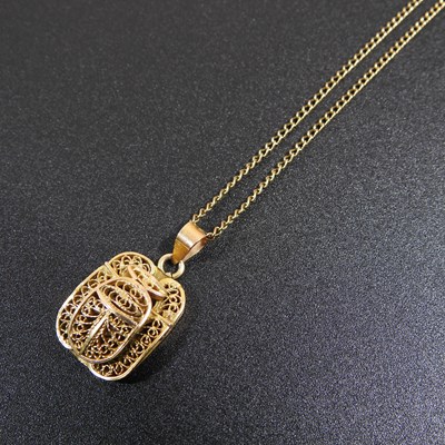 Lot 107 - A gilt Egyptian style scarab pendant, of...