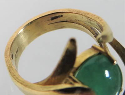 Lot 52 - A large 18 carat gold cabochon emerald ring