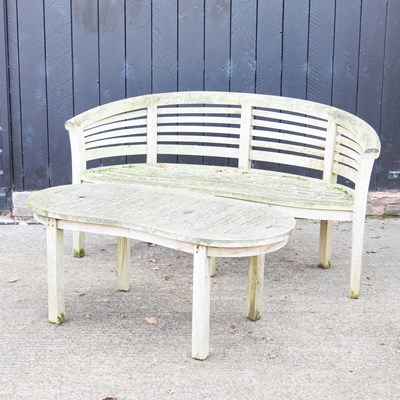 Lot 181 - A teak curved garden bench, together with a...