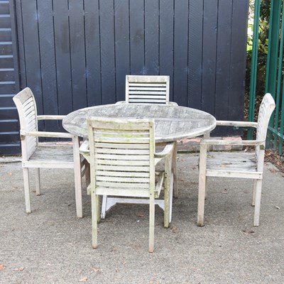 Lot 104 - A teak folding garden table, together with a...