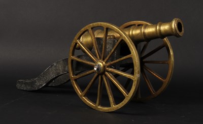 Lot 615 - A brass miniature table cannon