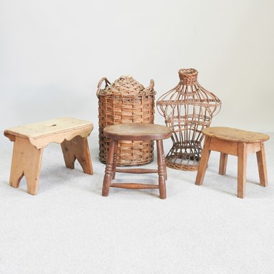 Lot 311 - A wicker stone bottle holder, 56cm high,...