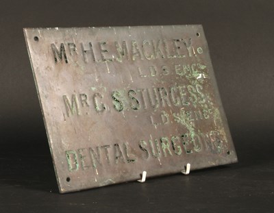 Lot 715 - A bronze dentist's plaque, inscribed Mr H. E....