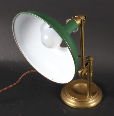 Lot 807 - A vintage brass desk lamp, having a green...
