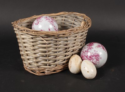 Lot 525 - A collection of porcelain eggs and carpet bowls