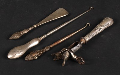 Lot 59 - A collection of silver-handled implements,...