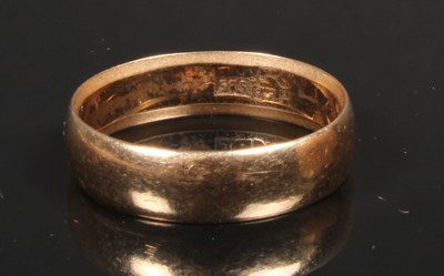 Lot 21 - A 14 carat yellow gold wedding band, size S, 4.1g