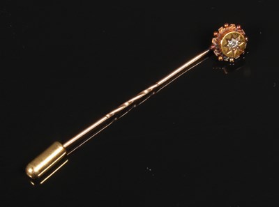 Lot 65 - A 9 carat yellow gold diamond set pin, 1.6g