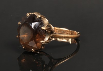 Lot 54 - A large 9 carat smoky quartz ring, adjusted to...