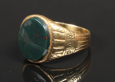 Lot 13 - A 14 carat yellow gold bloodstone signet ring,...