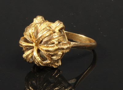 Lot 20 - A yellow metal dress ring, of tiered shape,...
