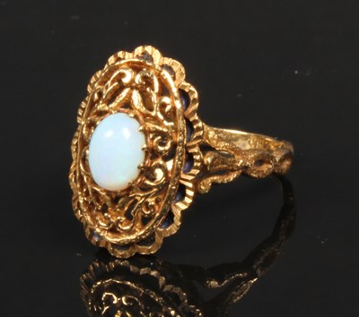 Lot 28 - A yellow metal opal dress ring, probably 9...