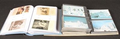 Lot 820 - A collection of vintage postcards, housed in...