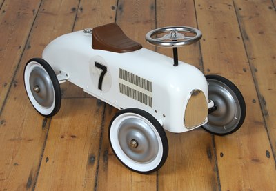Lot 797 - A Vilac white painted metal child's ride-on...
