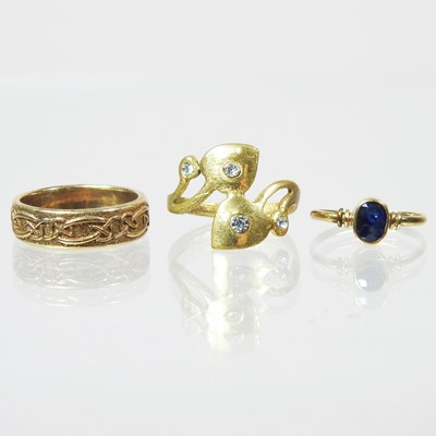 Lot 159 - A 9 carat gold band, decorated in relief with...