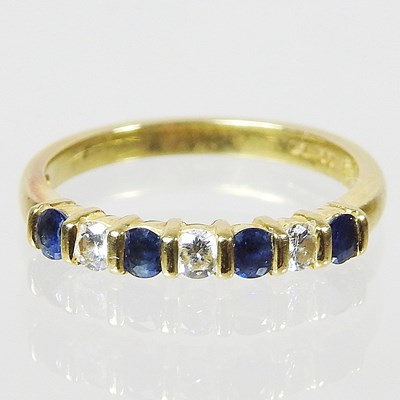 Lot 98 - An 18 carat gold sapphire and diamond half...