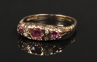 Lot 40 - A 9 carat gold ruby and diamond ring, in a...