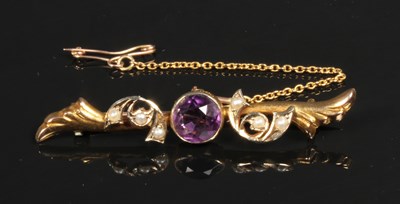 Lot 33 - An amethyst and seed pearl brooch, tests as 9...