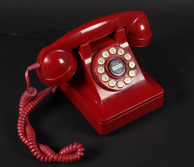 Lot 630 - A red Wild & Wolf rotary telephone