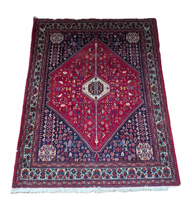 Lot 462 - A Persian rug, on a red ground, 204x154cm