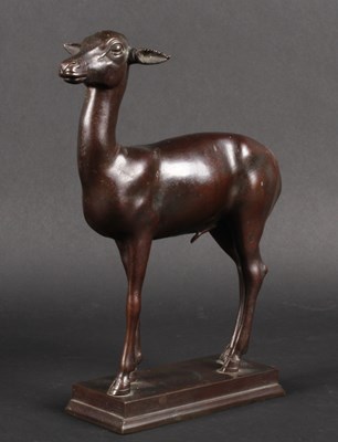 Lot 114 - A bronze model of a deer, shown in standing...