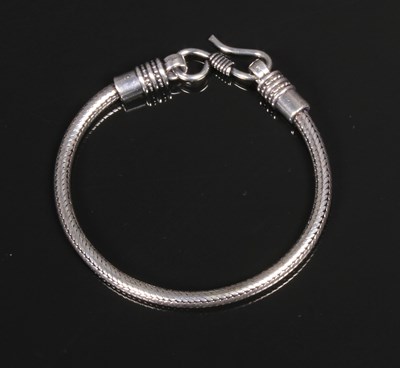 Lot 87 - A white metal snake bracelet