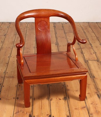 Lot 205 - A Chinese hardwood low chair, with a horseshoe...