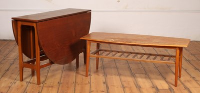 Lot 397 - A mid-century teak drop-leaf dining table, h....