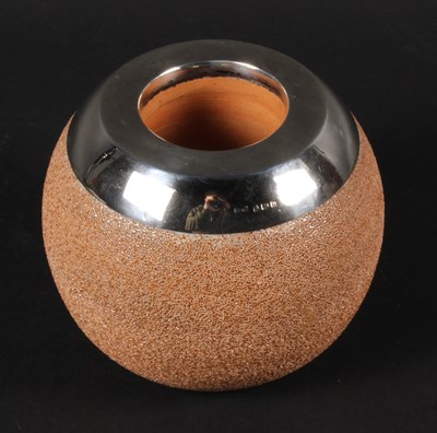 Lot 74 - A Royal Doulton stoneware table top silver...