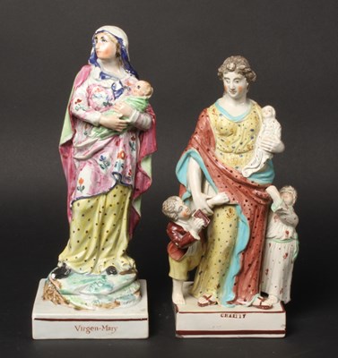Lot 129 - A Staffordshire figure depicting the Virgin...