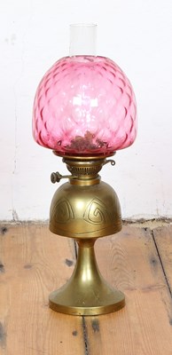 Lot 653 - An Arts & Crafts brass oil lamp, having a...