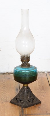 Lot 656 - An Edwardian oil lamp, having a teal glass...