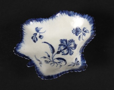 Lot 154 - An English blue and white soft paste porcelain...